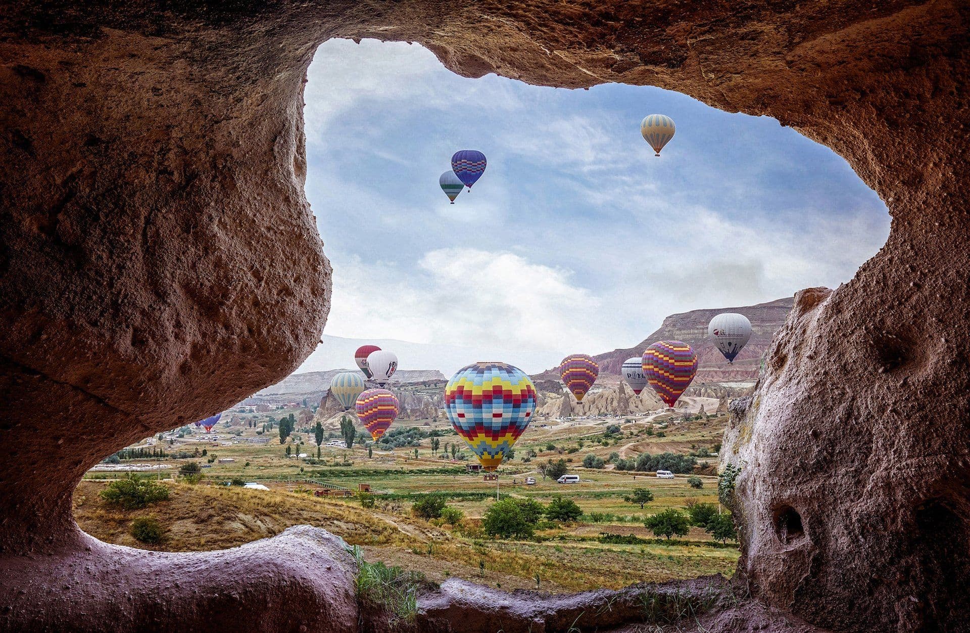 Hot-air balloons rising at sunrise over Cappadocia